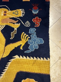 A Sino-Tibetan inscribed woollen 'Dragon' pillar carpet, 19th C.