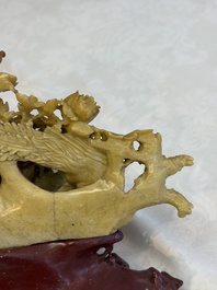 A fine Chinese carved soapstone 'Squirrels and Grapes' group and a 'Phoenixes among Peonies' group, 20th C.