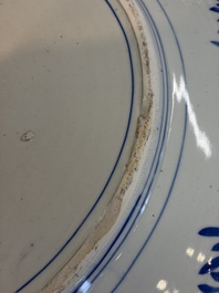 A massive Japanese blue and white 'Dragon among Sea Waves' dish, probably Arita, Meiji, 19th C.