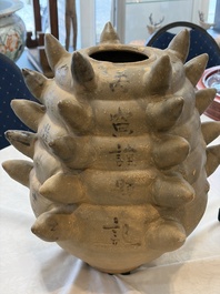 A large inscribed Chinese spiked funerary jar and cover, Northern Song, dated 1026