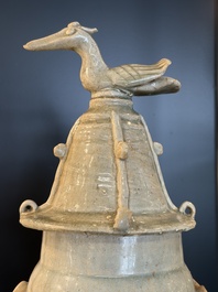 A large Chinese qingbai covered urn applied with immortals and a dragon, Northern Song