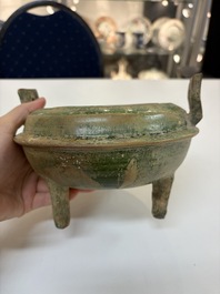 A Chinese green-glazed pottery ritual tripod food vessel with handles, 'Ding 鼎', Han