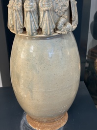 A large Chinese qingbai covered urn applied with immortals and a dragon, Northern Song