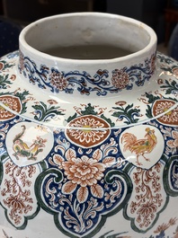 A large Dutch Delft cashmere palette vase with a phoenix and birds among flowers, ca. 1700
