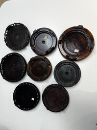 A collection of 70 Chinese wooden stands, 19/20th C.