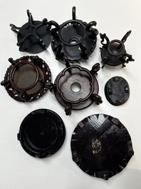 A collection of 70 Chinese wooden stands, 19/20th C.