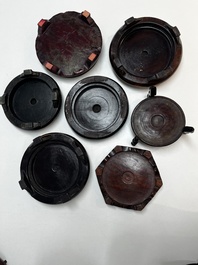 A collection of 70 Chinese wooden stands, 19/20th C.