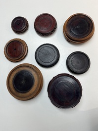A collection of 75 Chinese wooden stands, 19/20th C.