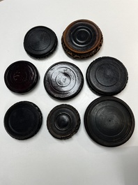 A collection of 70 Chinese wooden stands, 19/20th C.