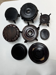A collection of 70 Chinese wooden stands, 19/20th C.