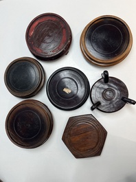 A collection of 70 Chinese wooden stands, 19/20th C.