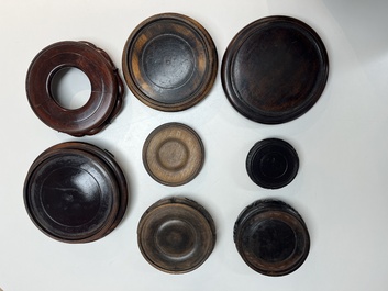 A collection of 75 Chinese wooden stands, 19/20th C.