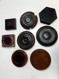 A collection of 70 Chinese wooden stands, 19/20th C.