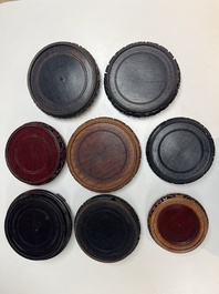A collection of 80 Chinese wooden stands, 19/20th C.