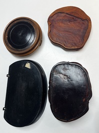 A collection of 40 mainly Chinese wooden stands, 19/20th C.