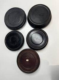 A collection of 40 mainly Chinese wooden stands, 19/20th C.
