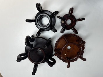 A collection of 40 mainly Chinese wooden stands, 19/20th C.