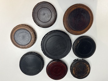 A collection of 80 Chinese wooden stands, 19/20th C.