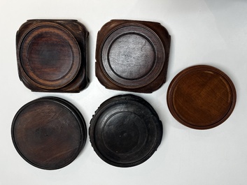 A collection of 40 mainly Chinese wooden stands, 19/20th C.