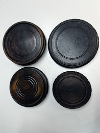A collection of 40 mainly Chinese wooden stands, 19/20th C.