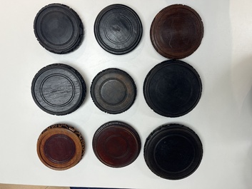 A collection of 80 Chinese wooden stands, 19/20th C.
