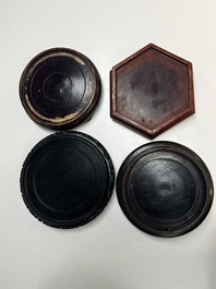 A collection of 40 mainly Chinese wooden stands, 19/20th C.