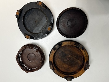 A collection of 80 Chinese wooden stands, 19/20th C.