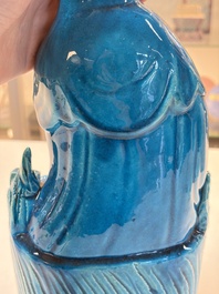 A Chinese turquoise-glazed Guanyin, a white-glazed bottle vase and a blue and white jar, 19th C.