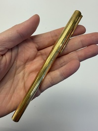A gold-plated twist ballpoint pen and a fountain pen with an 18kt gold nib, S.T. Dupont Paris, France, 20th C.