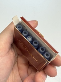 A gold-plated twist ballpoint pen and a fountain pen with an 18kt gold nib, S.T. Dupont Paris, France, 20th C.