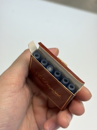 A gold-plated twist ballpoint pen and a fountain pen with an 18kt gold nib, S.T. Dupont Paris, France, 20th C.