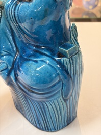 A Chinese turquoise-glazed Guanyin, a white-glazed bottle vase and a blue and white jar, 19th C.