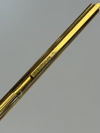 A gold-plated twist ballpoint pen and a fountain pen with an 18kt gold nib, S.T. Dupont Paris, France, 20th C.