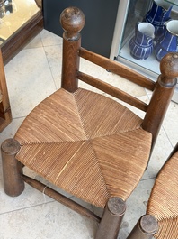 A pair of chairs in oak and straw, attributed to Charles Dudouyt, France, mid 20th C.