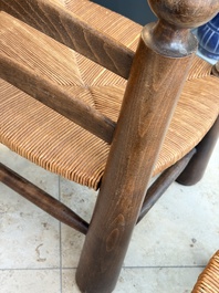 A pair of chairs in oak and straw, attributed to Charles Dudouyt, France, mid 20th C.