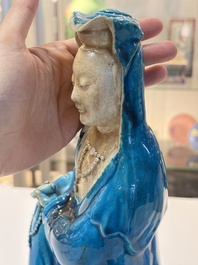 A Chinese turquoise-glazed Guanyin, a white-glazed bottle vase and a blue and white jar, 19th C.