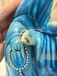 A Chinese turquoise-glazed Guanyin, a white-glazed bottle vase and a blue and white jar, 19th C.
