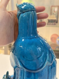 A Chinese turquoise-glazed Guanyin, a white-glazed bottle vase and a blue and white jar, 19th C.