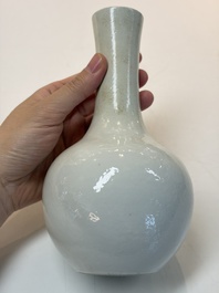 A Chinese turquoise-glazed Guanyin, a white-glazed bottle vase and a blue and white jar, 19th C.