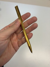 A gold-plated twist ballpoint pen and a fountain pen with an 18kt gold nib, S.T. Dupont Paris, France, 20th C.