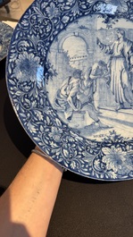 A pair of fine large blue and white Dutch Delft biblical subject dishes, dated 1781