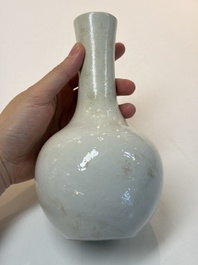 A Chinese turquoise-glazed Guanyin, a white-glazed bottle vase and a blue and white jar, 19th C.