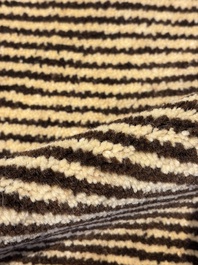 A very large Persian hand-knotted woollen carpet with a geometric patchwork design, 20th C.