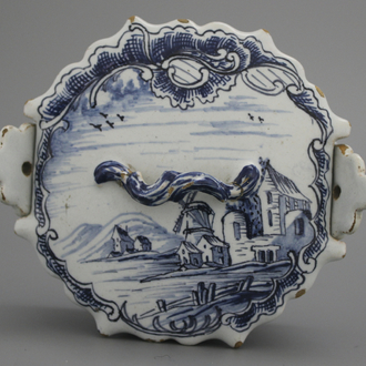 A fine Dutch Delft blue and white butter tub with landscape painting, 18th C.