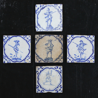 A set of 5 Dutch Delft blue and white tiles with various soldiers, 1st half 17th C.