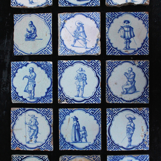 A set of 15 Dutch Delft blue and white tiles with various scenes of people, Wan-Li corners, 17th C.