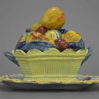 A polychrome Dutch Delft butter tub modelled after a fruit basket, 18th C.