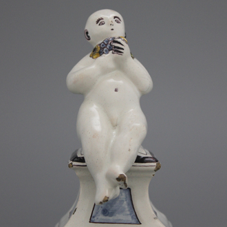 A French ceramic figure of a boy on a base, 18th C.
