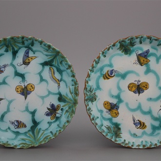 A pair of notched Brussels faience butterfly plates, 18th C.