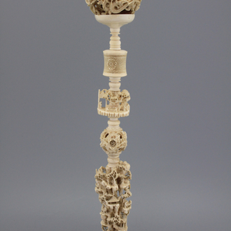 A large Chinese carved ivory puzzle ball on stand, 1st half 20th C.